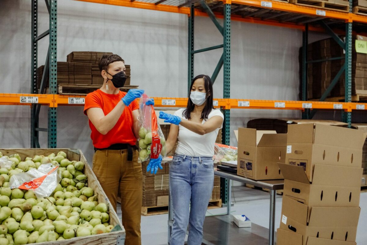 Volunteers repack produce at Northwest Harvest's Yakima Distribution Center