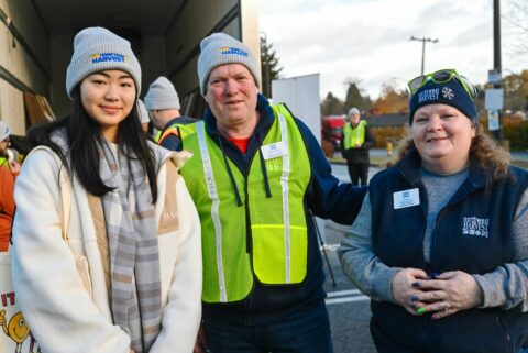 3 volunteers pose at Home Team Harvest 2023