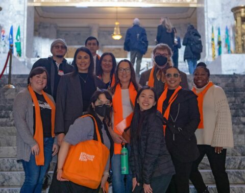 group poses inside capitol building during Hunger Action Day 2024