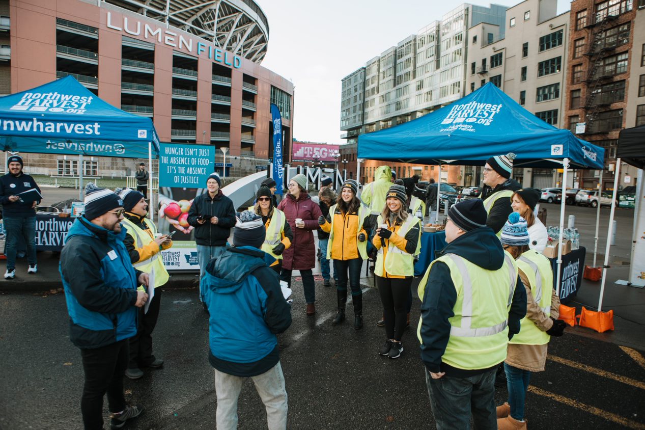 NWH staff and KING5 reporters at Lumen Field for Home Team Harvest 2022