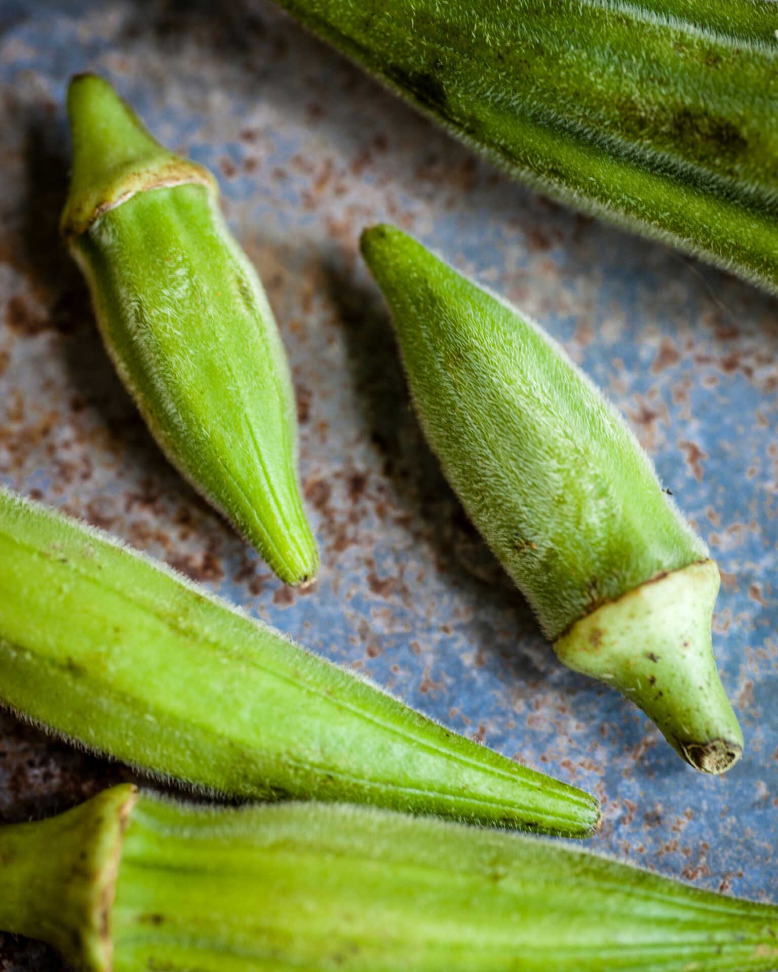 close up of small okra on table
