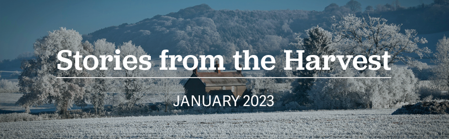 Stories from the Harvest January 2023 text on background of snowy field with house in background